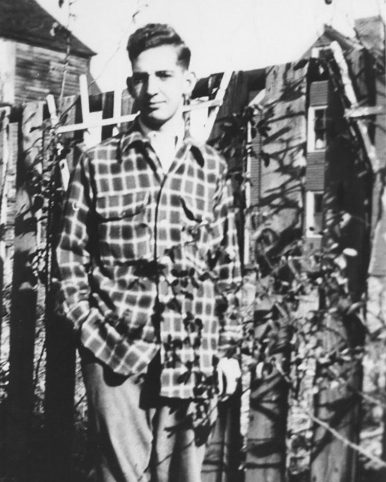Our founder, Leslie Clough, posed in the backyard of his shop in the late 1960s